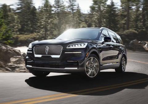 A Lincoln Aviator® SUV is being driven on a winding mountain road | Krenzen Lincoln in Duluth MN