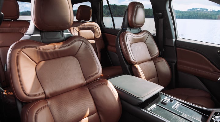 The front row's Perfect Position Seats in a 2024 Lincoln Aviator® Reserve model with Ebony Roast interior | Krenzen Lincoln in Duluth MN