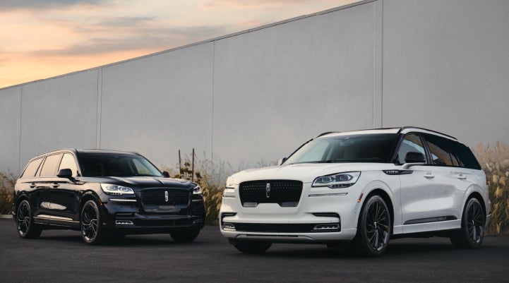 Two Lincoln Aviator® SUVs are shown with the available Jet Appearance Package | Krenzen Lincoln in Duluth MN