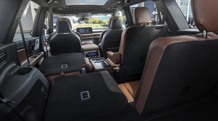One side of the PowerFold® third-row seat and a second-row seat are folded forward in the 2026 Lincoln Aviator® SUV. | Krenzen Lincoln in Duluth MN