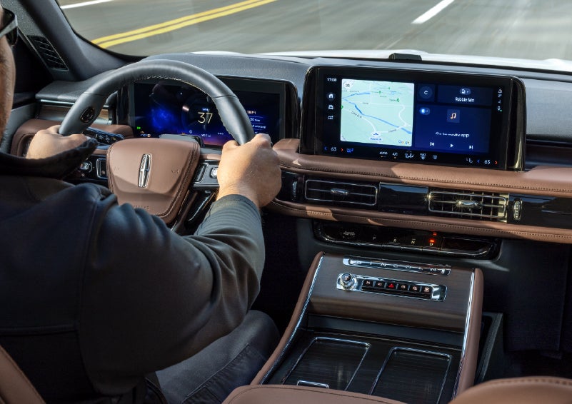 A person is driving a 2026 Lincoln Aviator® SUV as seen from inside the cabin. | Krenzen Lincoln in Duluth MN