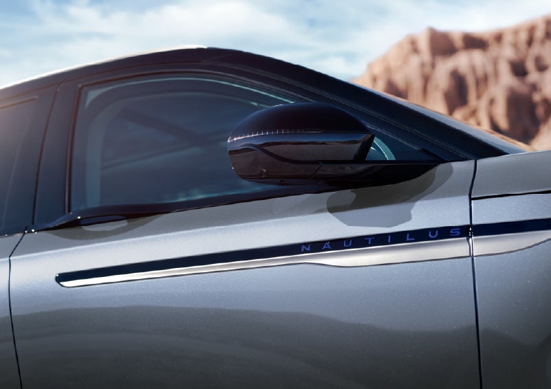 Blue lettering on the side of the vehicle that reads Nautilus indicates the available Hybrid Powertrain. | Krenzen Lincoln in Duluth MN