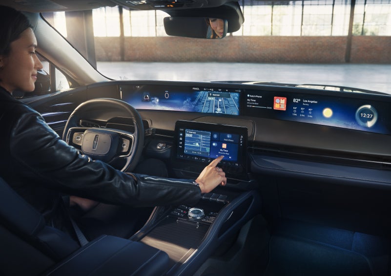 The driver of a 2026 Lincoln Nautilus® SUV interacts with the center touchscreen. | Krenzen Lincoln in Duluth MN