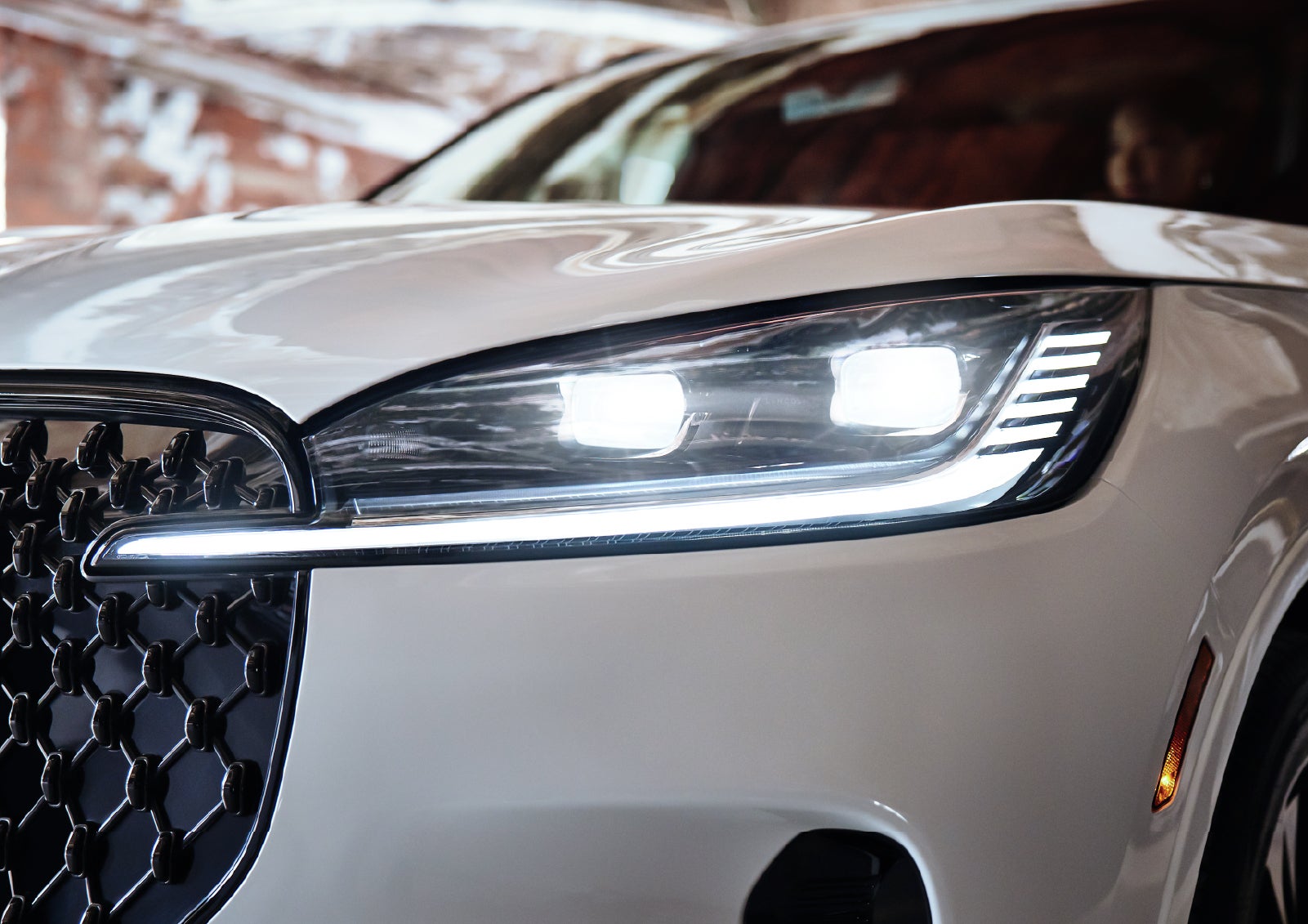 A close-up of a headlamp on the 2027 Lincoln Aviator® SUV is shown. | Krenzen Lincoln in Duluth MN