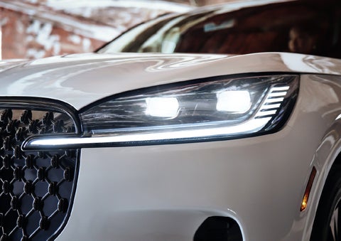A close-up of a headlamp on the 2027 Lincoln Aviator® SUV is shown. | Krenzen Lincoln in Duluth MN