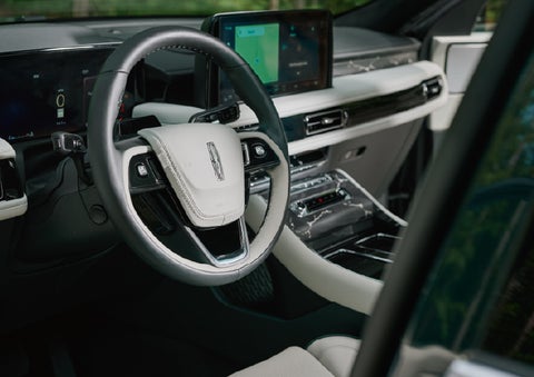 The leather-trimmed steering wheel of a 2027 Lincoln Aviator® Black Label™ SUV. | Krenzen Lincoln in Duluth MN
