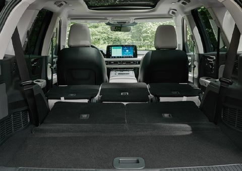 A rear to front view of the interior of a 2027 Lincoln Aviator® Black Label™ SUV shows the third and second rows folded flat | Krenzen Lincoln in Duluth MN